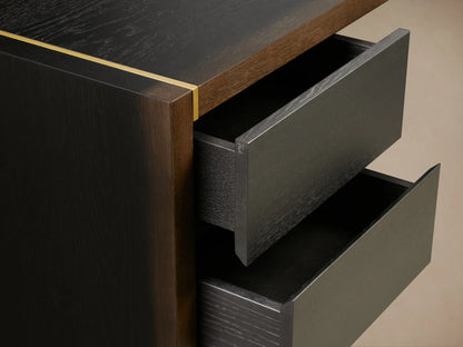 Mihaela Executive Desk in dark wood with a sleek design, featuring two side drawers and gold accents, set on wooden floor.