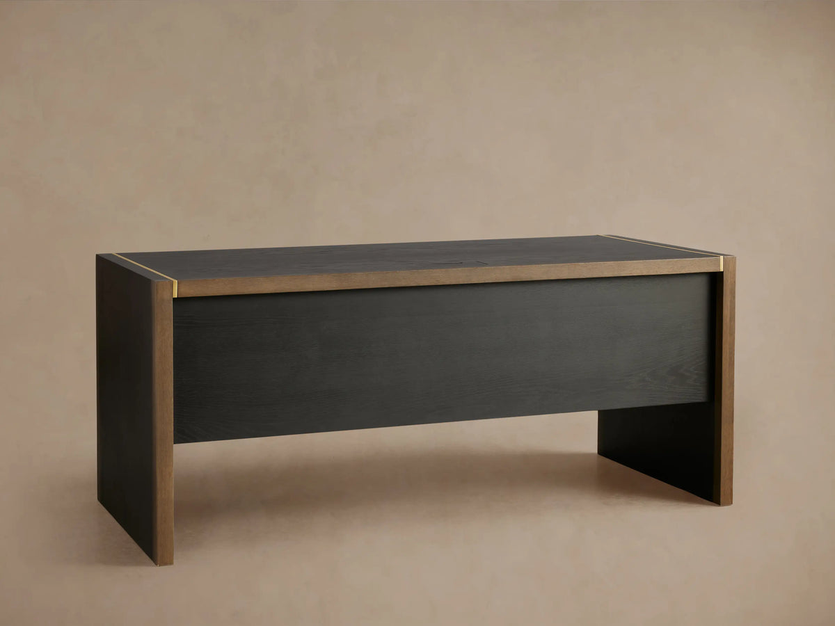 Mihaela Executive Desk in dark wood finish with two open drawers, highlighted with a gold accent on the corner. Close-up view.