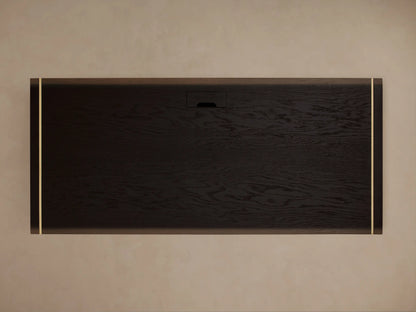 Mihaela Executive Desk with dark wood finish, gold trim edges, rectangular shape, and open base, set against a brown background.
