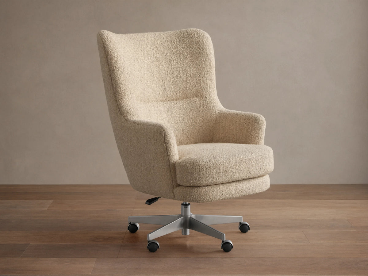 Montrose Desk Chair, light beige boucl??, high back, integrated arms, brushed metal 5-star caster base.