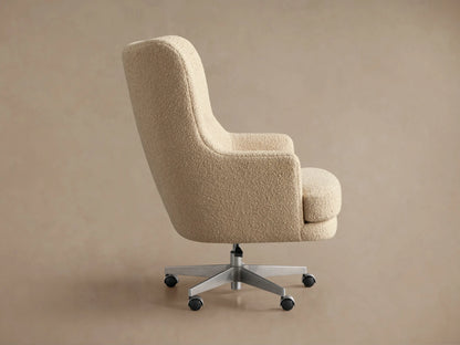 Back view of Montrose Desk Chair with light beige textured upholstery, silver five-star swivel base, and casters.