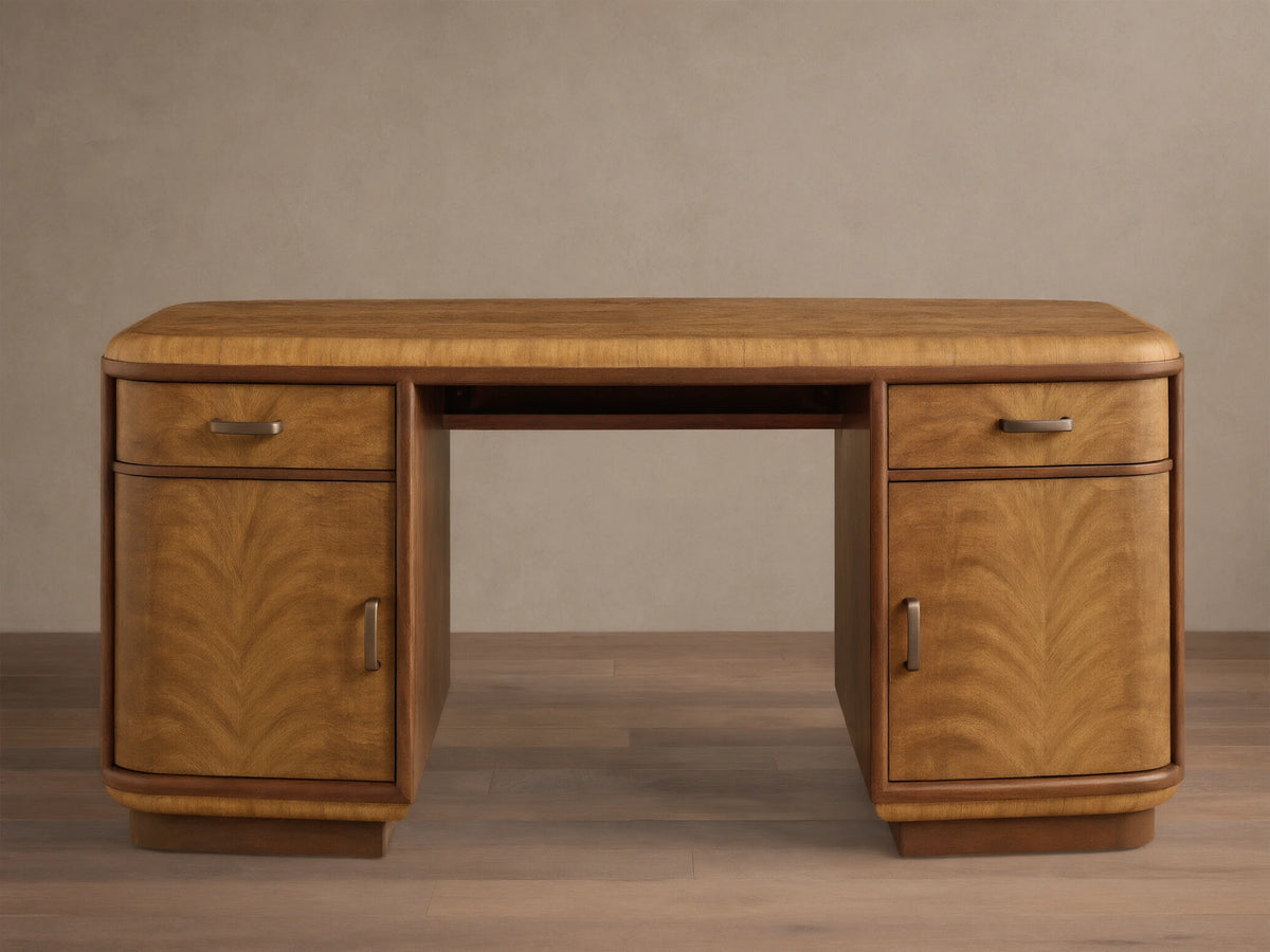 Front view of the brown Palma Executive Desk, featuring cerajeira wood veneers with arched graining, drawers, doors, and antique bronze hardware.