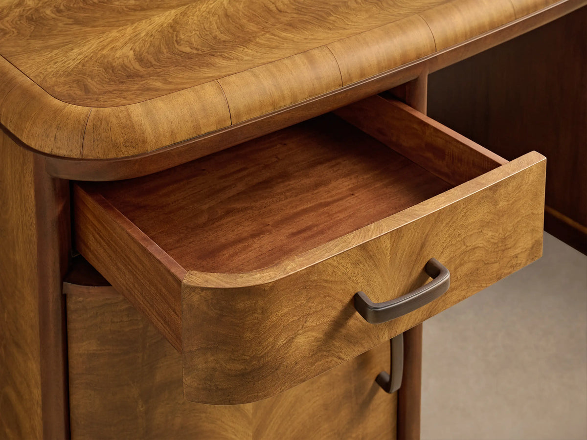 Front view of the Palma Executive Desk with cerajeira wood veneer, showing rich natural graining, two drawers, two doors, and bronze hardware.