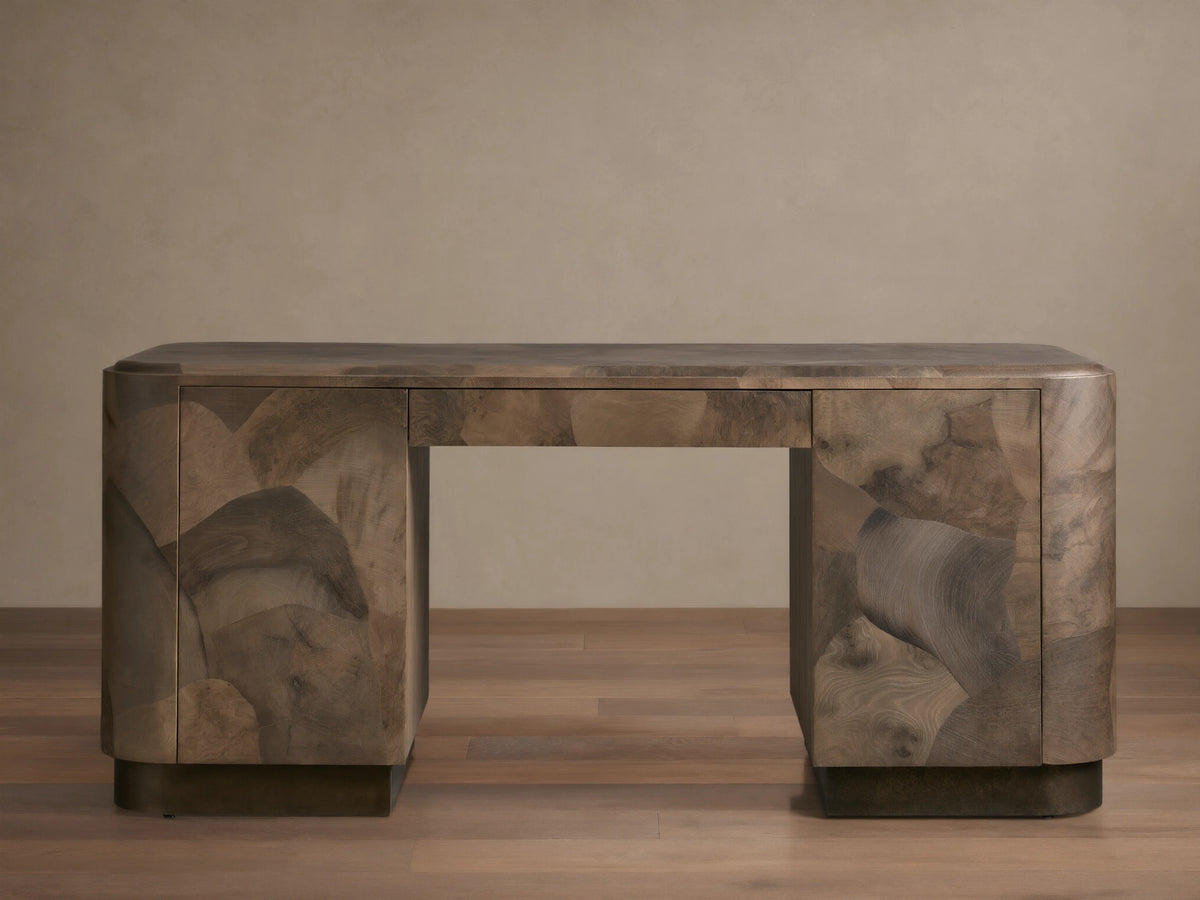Polanco Executive Desk made of oyster-cut wood with unique graining, standing on aged steel base. Features a smooth top and push-to-open doors.