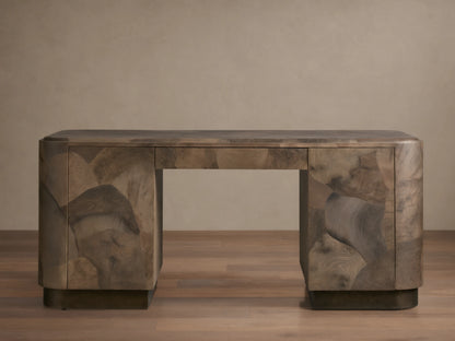 Polanco Executive Desk made of oyster-cut wood with unique graining, standing on aged steel base. Features a smooth top and push-to-open doors.