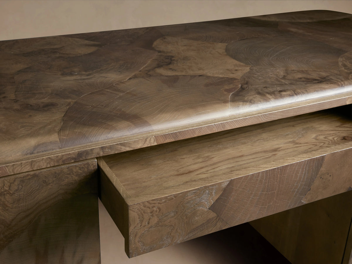 Polanco Executive Desk in close-up, showcasing the oyster-cut salvaged Mexican ash surface with natural graining. Visible center drawer slightly open.