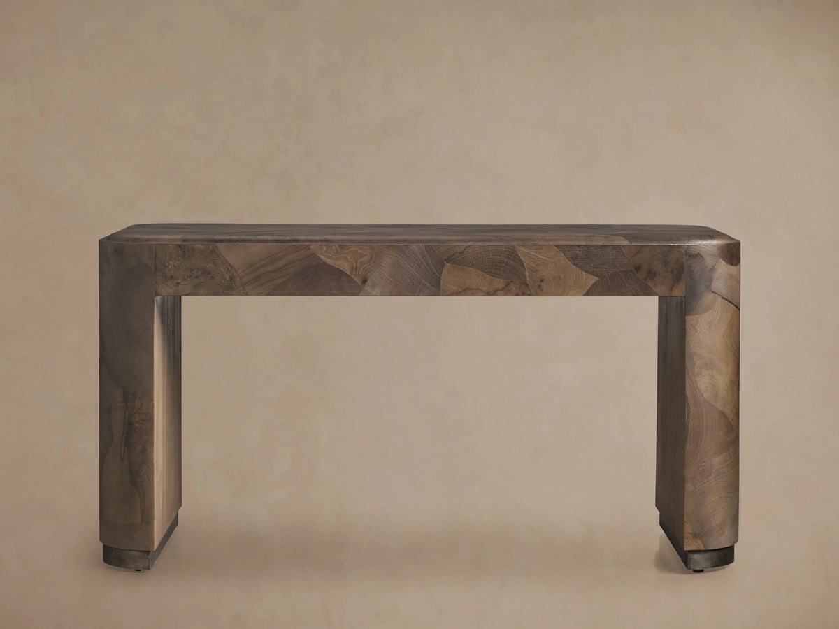 Polanco Writing Desk featuring a rectangular wooden top and legs with a varied brown oyster-cut wood pattern, set against a neutral background.