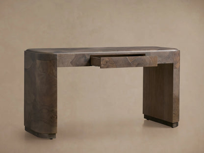 Polanco Writing Desk with a smooth, rounded edge and open center drawer. Made from oyster-cut ash, displaying natural wood grain patterns.