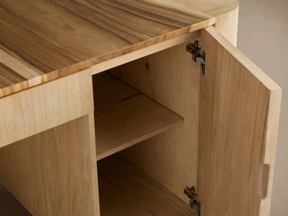 Ramiro Executive Desk: Light oak wood desk with dark wood inlay top, central drawer, two side doors, and sculptural rounded edges.