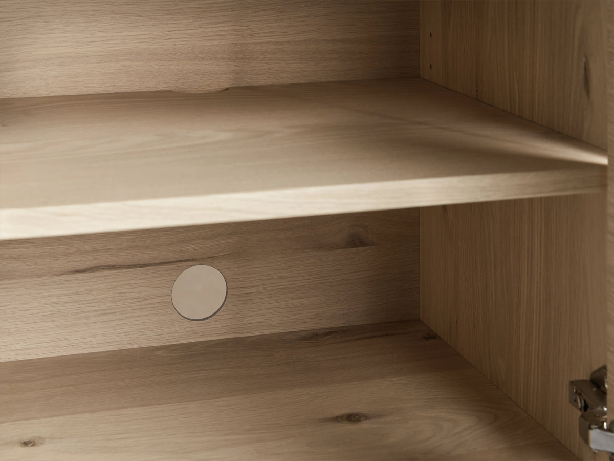 Sullivan Bookcase in Northman Oak with cabinet base, showing black resin-filled cracks and dual solid iron handles.