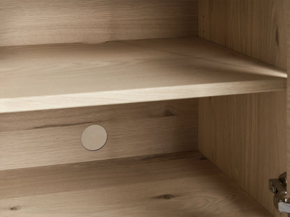 Sullivan Bookcase in Northman Oak with cabinet base, showing black resin-filled cracks and dual solid iron handles.