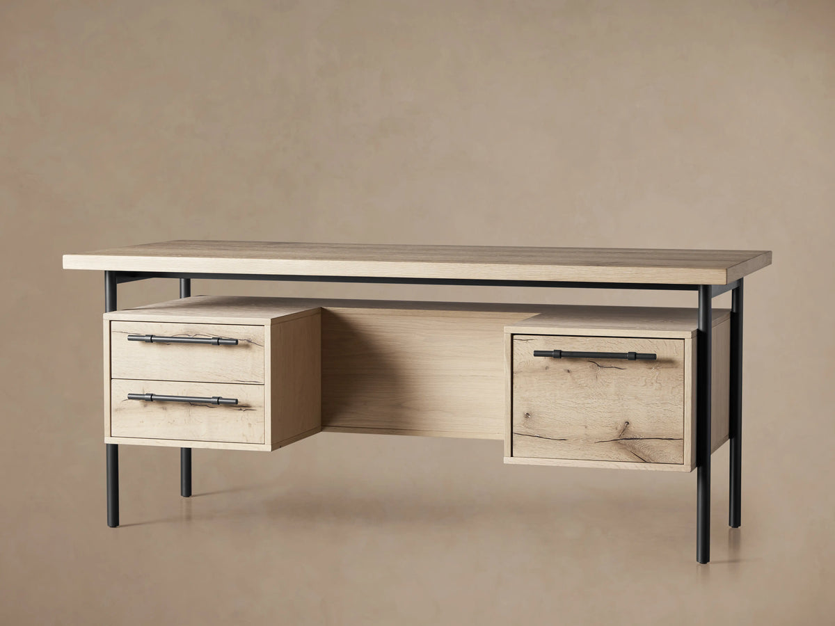 Sullivan Executive Desk in light oak with two drawers featuring black iron handles, set on a metal frame, highlighting natural wood textures.