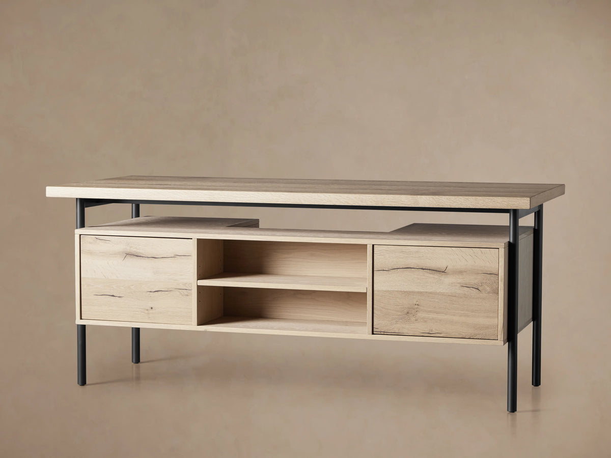 Open drawer of Sullivan Executive Desk in Northman Oak finish, showcasing a solid iron handle and natural wood grain with unique textures.