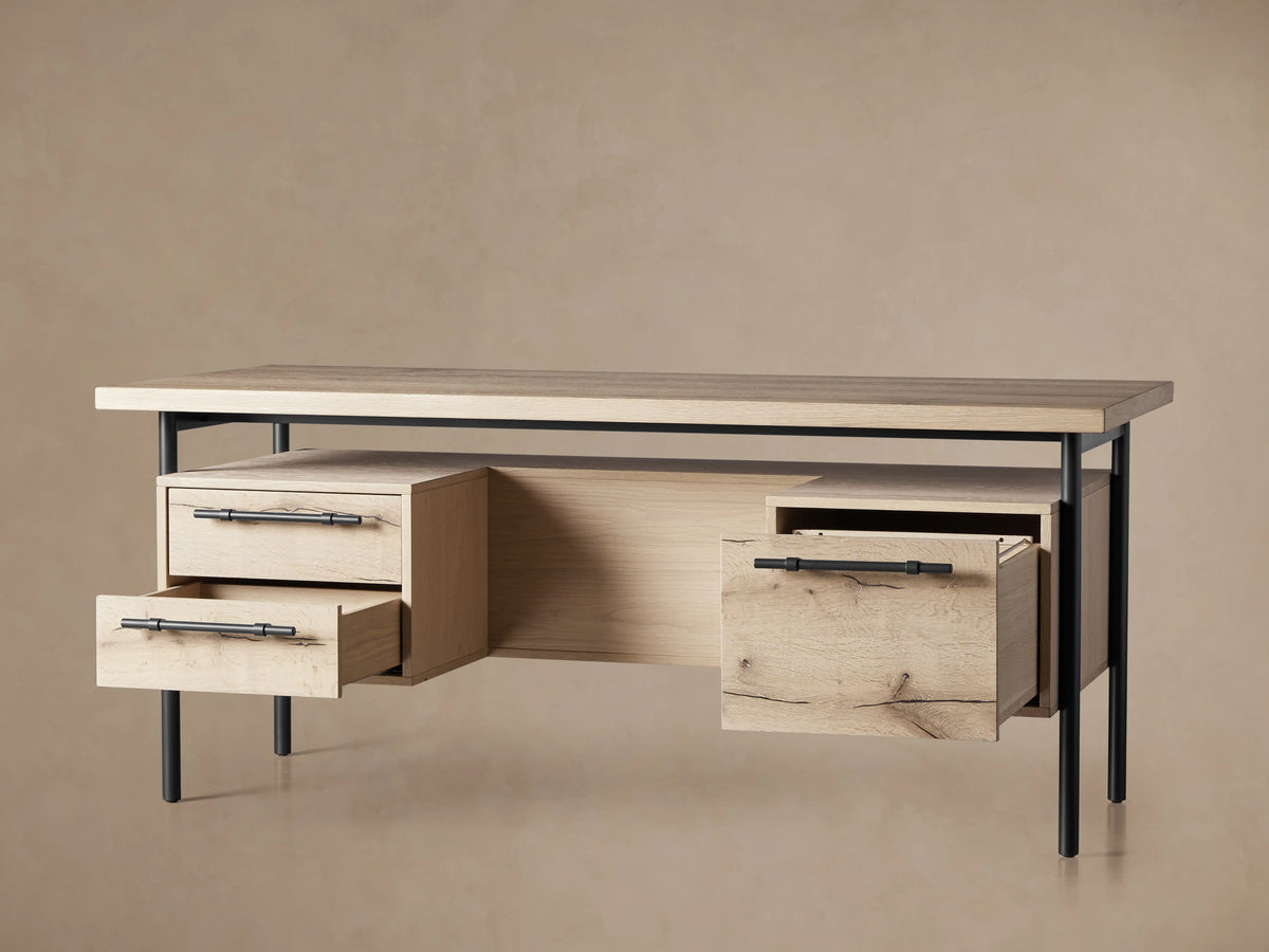 Sullivan Executive Desk corner showing natural oak grain on top, black resin-filled cracks, a drawer with an iron handle, and metal legs.