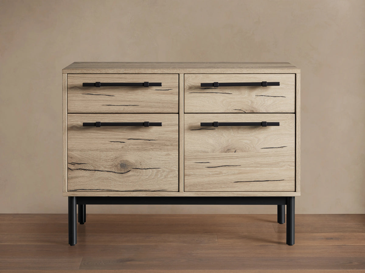 Sullivan File Cabinet in Northman Oak finish, showing four drawers with black iron handles, wood grain, and natural weathering details.