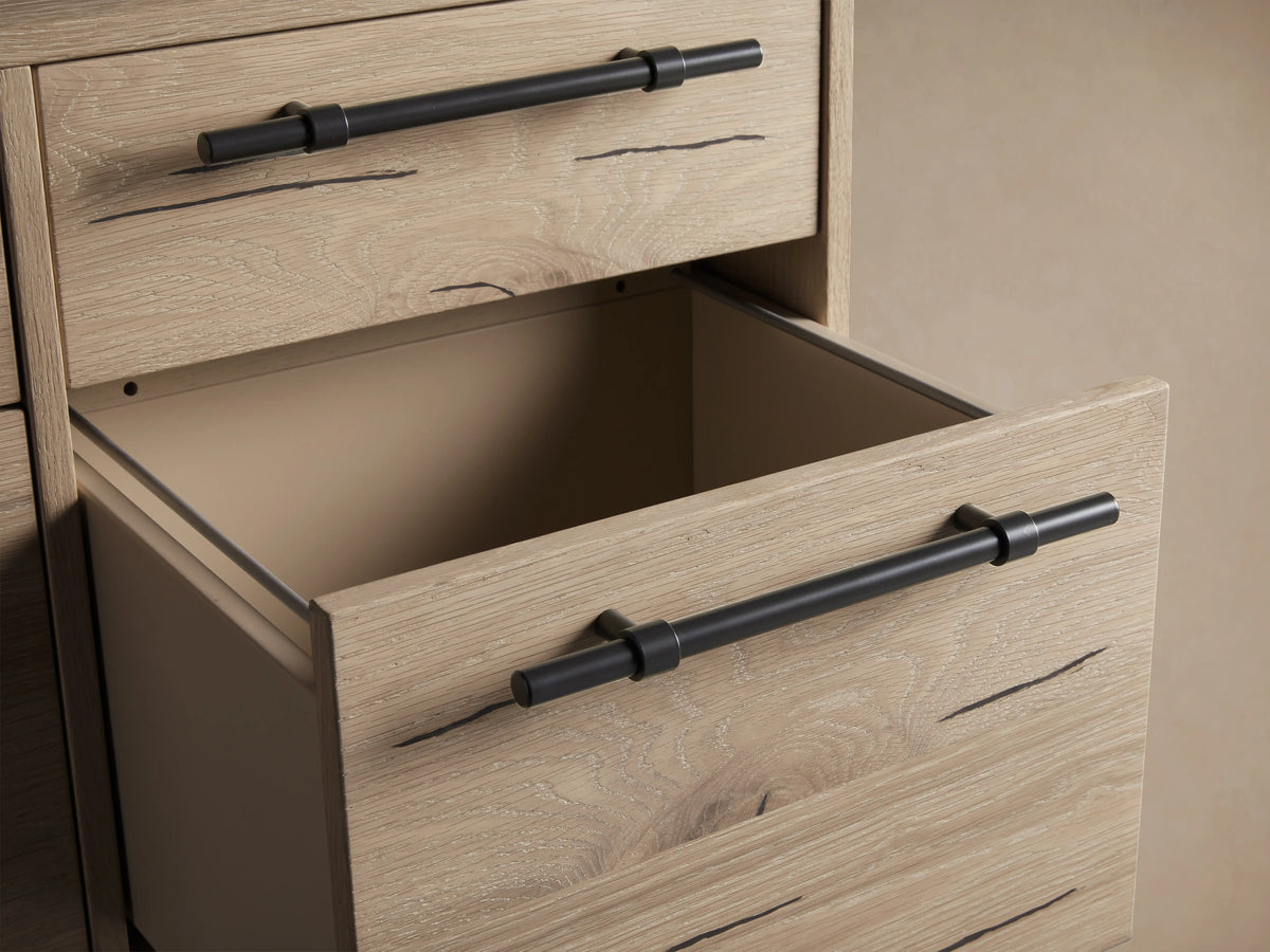 Sullivan File Cabinet in Northman Oak finish, showing four drawers with black iron handles, wood grain, and natural weathering details.