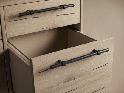 Sullivan File Cabinet in Northman Oak finish, showing four drawers with black iron handles, wood grain, and natural weathering details.
