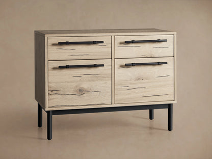 The Sullivan File Cabinet in a Northman Oak finish, featuring iron handles and a partially open drawer showcasing natural wood grain and cracks.