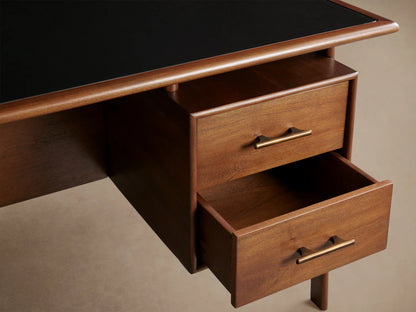 Towry Executive Desk: dark mahogany, black glass top, four drawers with brass pulls, angled view on light background.