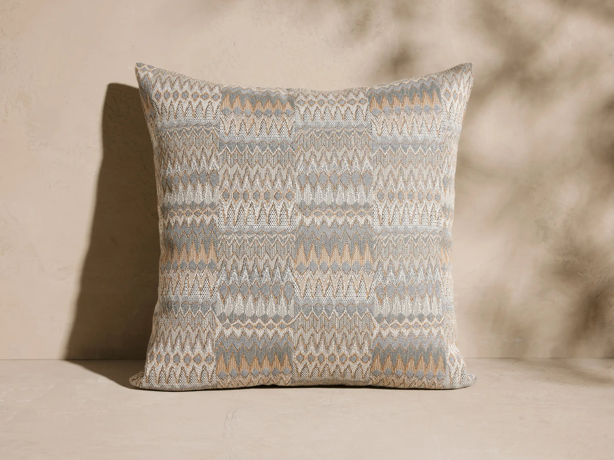 Naya Outdoor Pillow, square, textured jacquard in light gray, cream, and tan geometric zig-zag pattern.