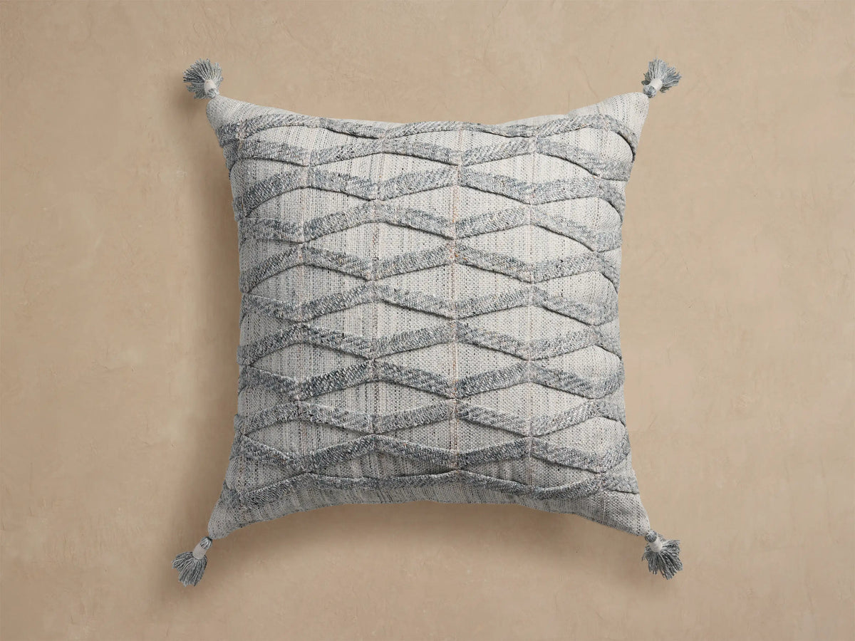Mesa Outdoor Floor Pillow: Square, light gray with raised textured diamond pattern and tassels on each corner.