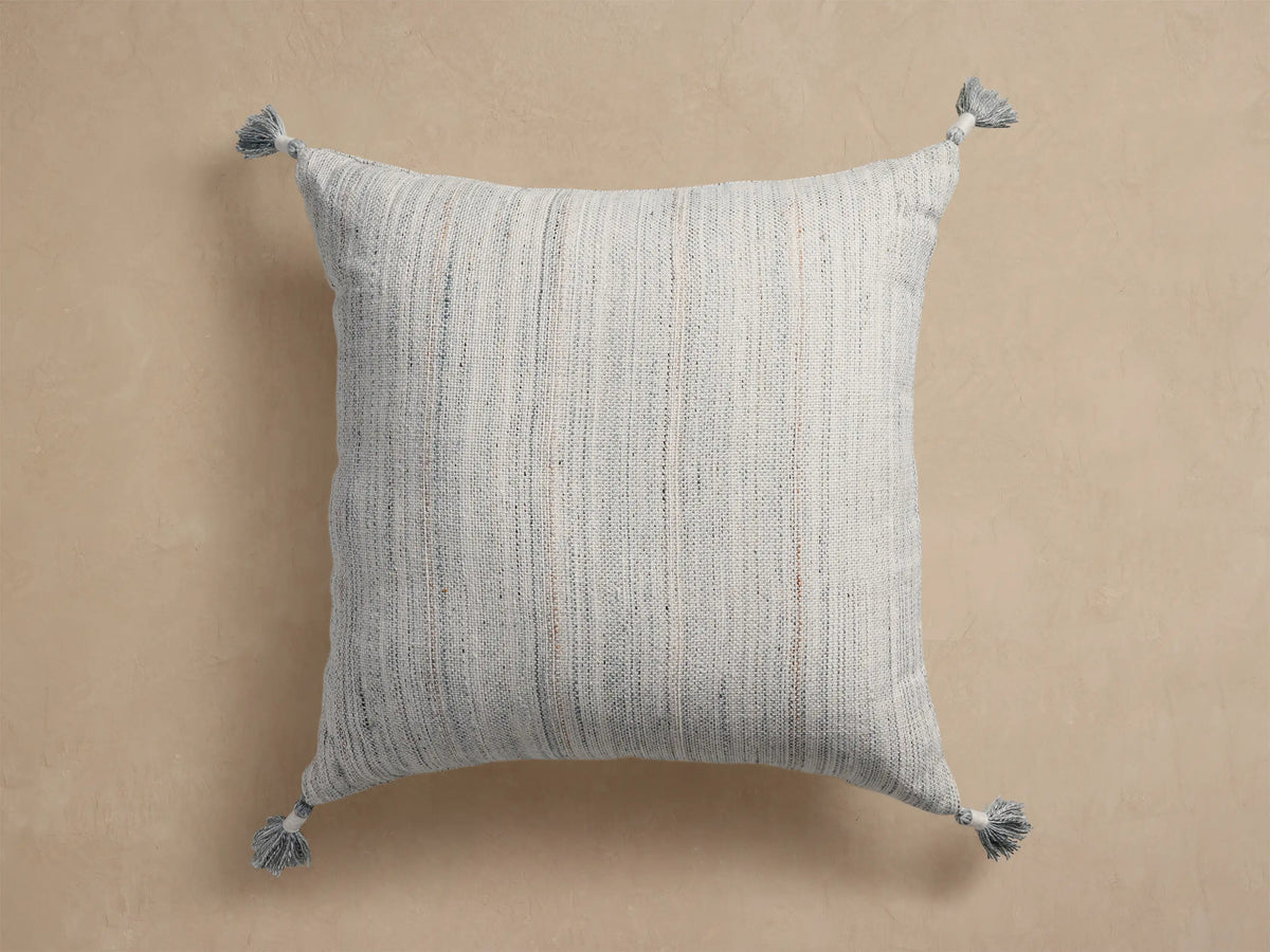 Mesa Outdoor Floor Pillow: Square, light gray with raised textured diamond pattern and tassels on each corner.