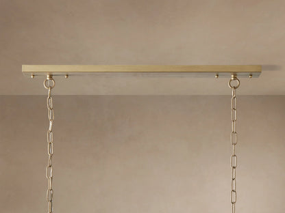 Leyland Tiered Rectangular Chandelier: Oil-rubbed bronze frame with two tiers of clear K9 glass crystals, illuminated, hanging by chains.