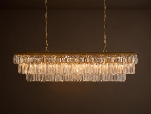 Leyland Tiered Rectangular Chandelier: Oil-rubbed bronze frame with two tiers of clear K9 glass crystals, illuminated, hanging by chains.