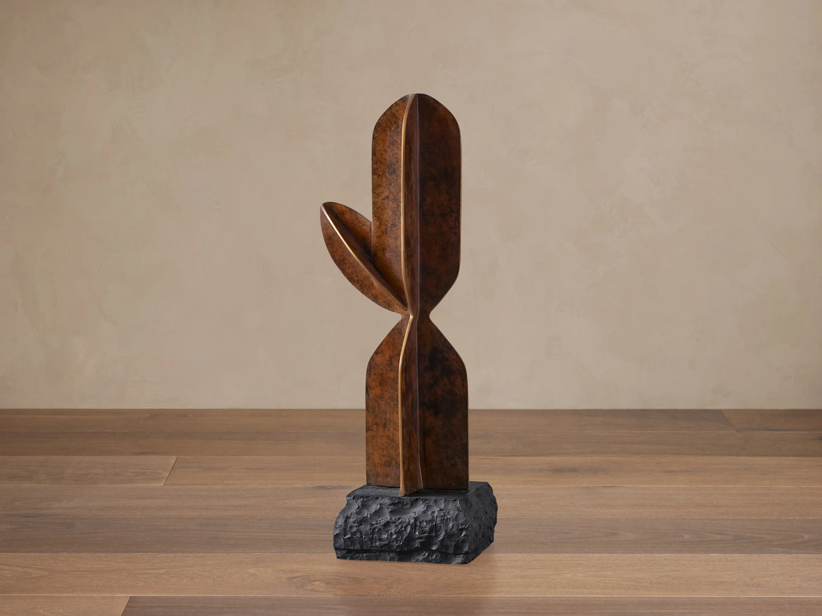 Modern Patina Cactus Sculpture, upright, with a bronze-patinaed finish, clean lines, and a dark, textured rock base.