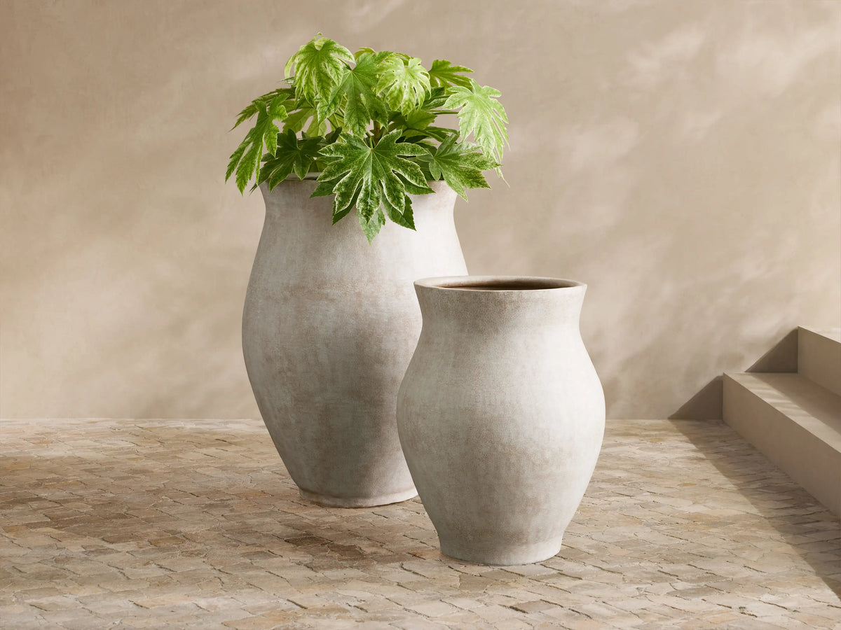 Two Gable Outdoor Planters, large and small, with weathered terracotta-like finish, on a light-tiled outdoor patio.