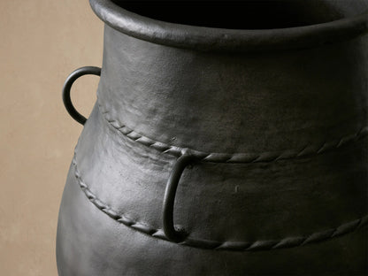 Ilya Wide Outdoor Planter, deep charcoal aluminum with aged metal patina, wide body, twisted rope detail & rings, on light tile.