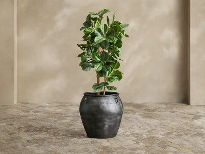 Close-up of dark charcoal Ilya Outdoor Planter, showing aged metal texture, embossed horizontal band, and a single C-ring.