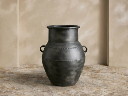 Ilya Outdoor Planter: large, dark charcoal aluminum, aged patina, rounded shape, handles, textured horizontal bands.
