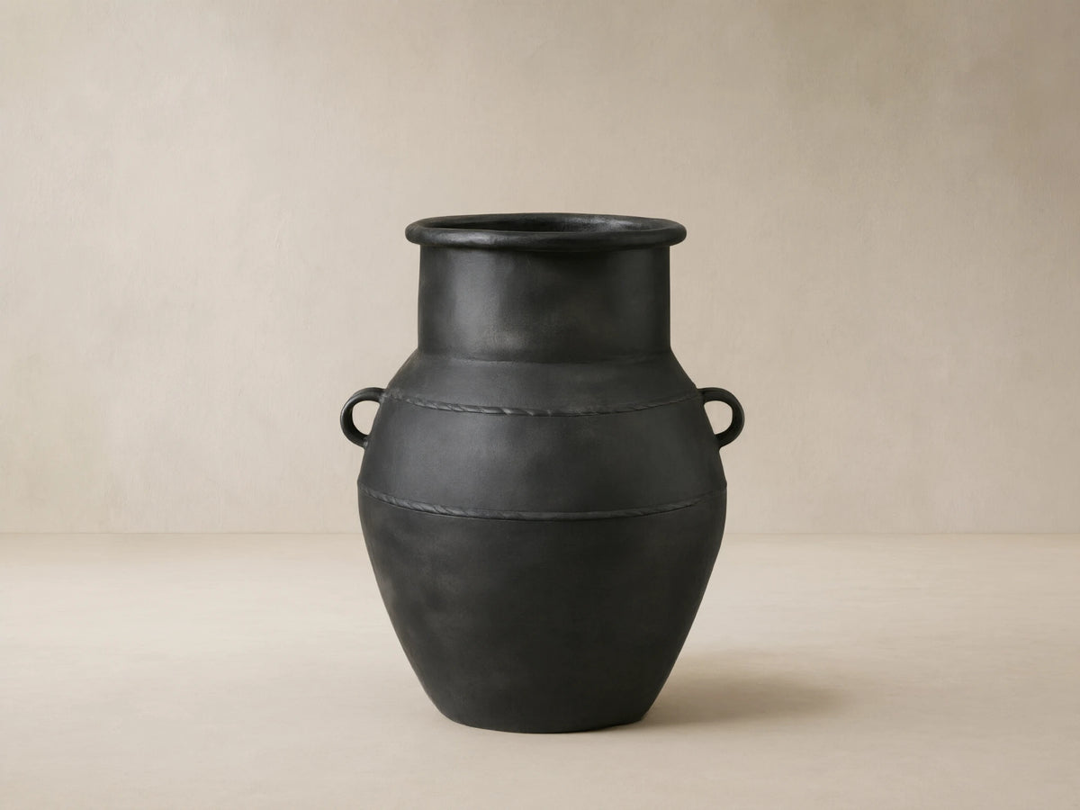 Ilya Outdoor Planter: large, dark charcoal aluminum, aged patina, rounded shape, handles, textured horizontal bands.