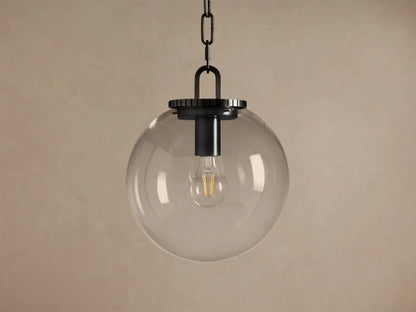 Wescott Globe Pendant: Clear glass globe with a visible filament bulb, dark metal chain and fixture, hanging against a neutral wall.