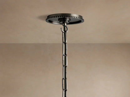 Close-up of Wescott Globe Pendant in dark bronze with ribbed detail, holding a clear glass globe and visible light bulb.