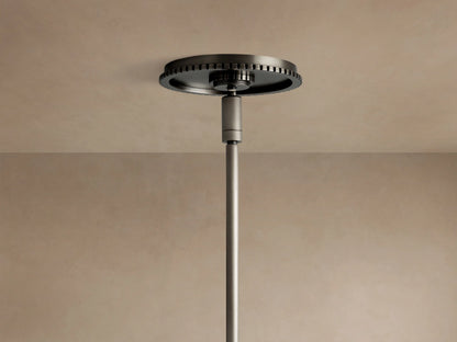 Wescott Globe Pendant: Close-up of a white milk glass globe and dark bronze etched metal ring with rod.