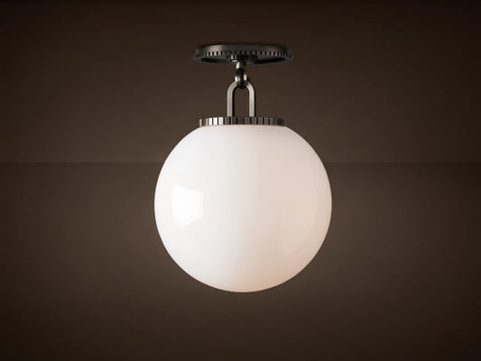 Wescott Globe Flush Mount with opaque white milk glass sphere and dark bronze hardware, against a light brown ceiling.