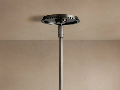 Wescott Globe Pendant: Close-up of dark bronze steel rod attached to a fluted ring holding a smoky clear glass globe.