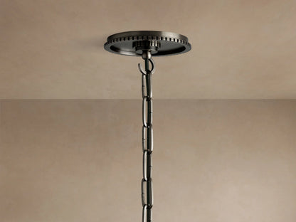 Close-up of Wescott Globe Pendant, showing top of clear glass globe, dark metal hardware with ribbed ring.