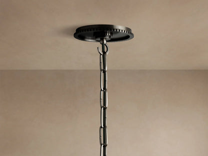 Wescott Globe Pendant: Close-up of a white milk glass globe meeting a dark bronze ribbed metal fitting and suspension rod.