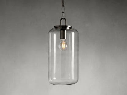 Wescott Cylinder Pendant with clear glass and bronze finish. Features an exposed bulb inside, hanging from a black chain.