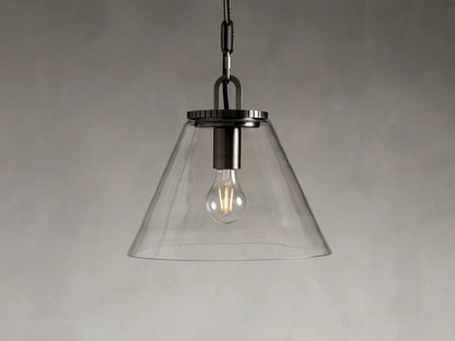 Cone-shaped pendant light with clear glass shade, suspended by a chain. Visible light bulb inside, with brass or bronze finish.