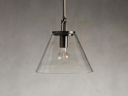 Close-up of the Wescott Cone Pendant in steel with a bronze finish, featuring a clear glass cone and a grooved metal top.