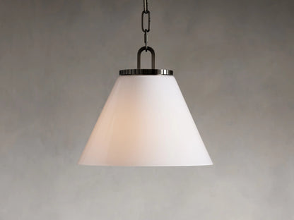 Wescott Cone Pendant with a white milk glass shade, suspended by a brass chain. Cone shape with sleek metal accent at top.