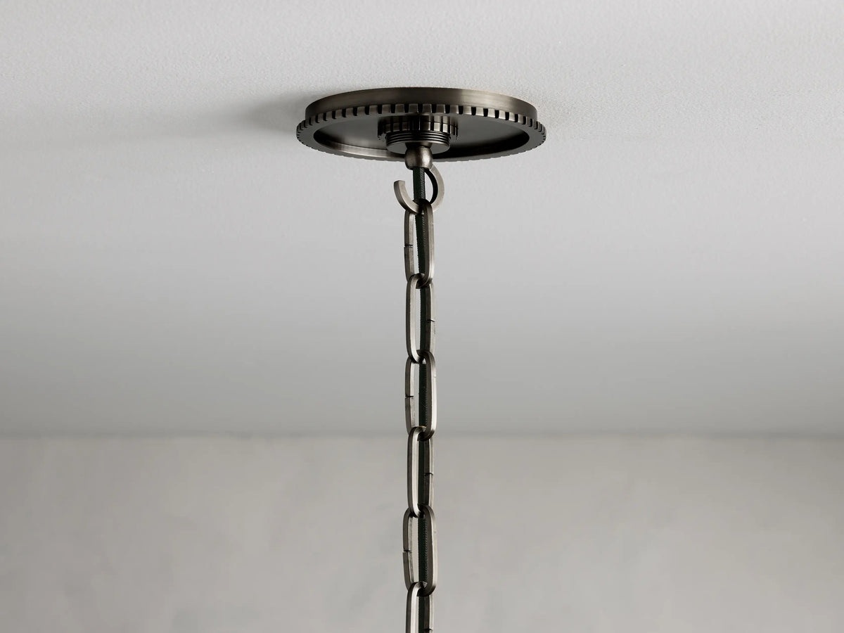 Wescott Cone Pendant features a white milk glass cone shade, metal trim, and chain, shown hanging vertically.