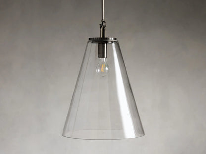 Clear glass cone pendant light with visible bulb and dark metal fixture, suspended from a rod against a gray background.