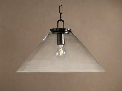 Wescott Cone Pendant: clear glass cone shade, dark bronze finish hardware, and exposed Edison bulb hanging against a tan wall.