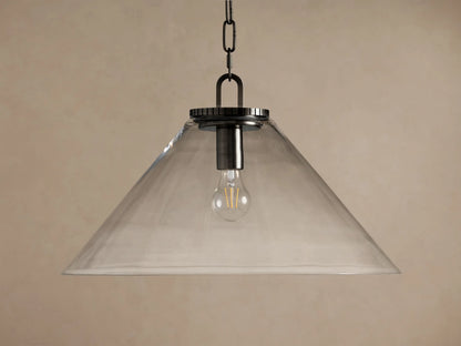 Wescott Cone Pendant: clear glass cone shade, dark bronze finish hardware, and exposed Edison bulb hanging against a tan wall.