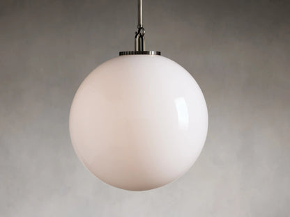Clear glass globe pendant light with black metal rod, showing interior bulb. Globe is large and spherical, hanging vertically.